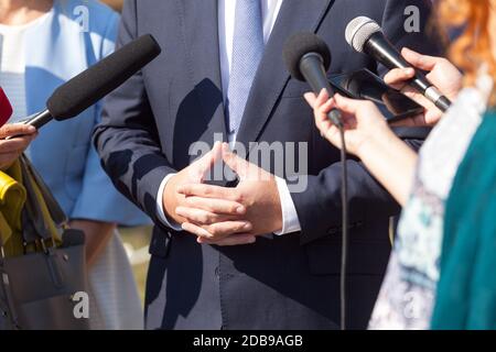 Journalists making media interview with businessman or politician Stock Photo