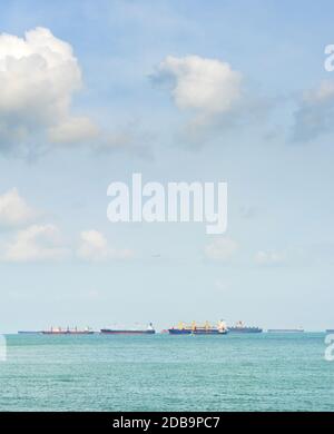 Industrial cargo shipping tankers in Singapore harbor Stock Photo