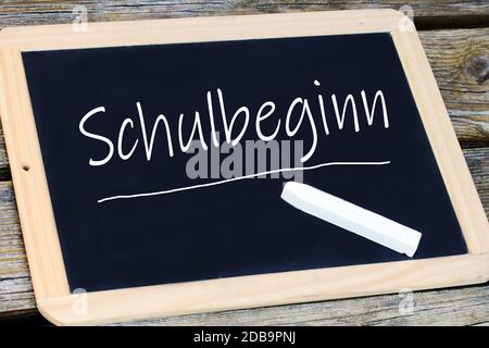 On a blackboard the start of school is written. School starts again Stock Photo