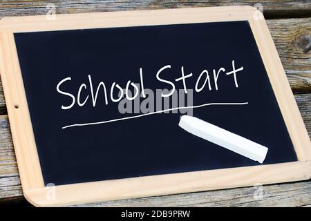 On a blackboard the start of school is written. School starts again Stock Photo