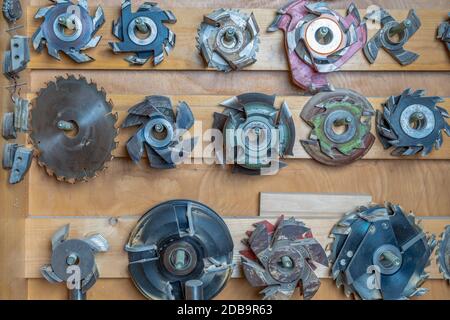 replaceable saw blades of different sizes in a cabinet in a joinery. Stock Photo