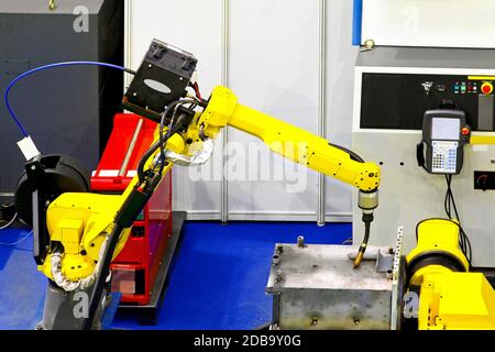 Automatic robotic arm for metal welding operations Stock Photo