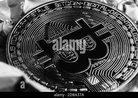 Bitcoin on silver background. Halving cryptocurrency. The crisis in the economy. Macro photo Stock Photo