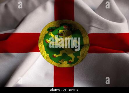 Ruffled Flag of Alderney Blowing in Wind Stock Photo