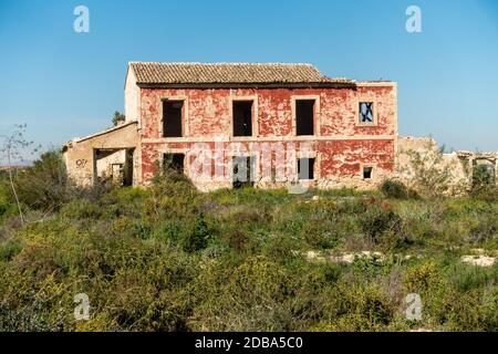 Old derelict house in Spain amidst fields and orange groves Stock Photo