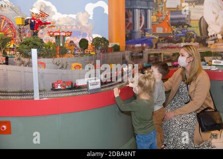 Dallas, USA. 16th Nov, 2020. People view train models at a train exhibition in Dallas, Texas, the United States, on Nov. 16, 2020. The 2020 Trains at NorthPark in Dallas has become one of the city's premier holiday traditions. The exhibition runs from Nov. 14 to Jan. 3. Credit: Dan Tian/Xinhua/Alamy Live News Stock Photo