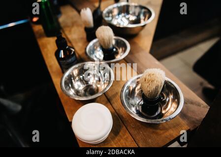 the tools of a Barber on the desktop in front of the mirror Stock Photo