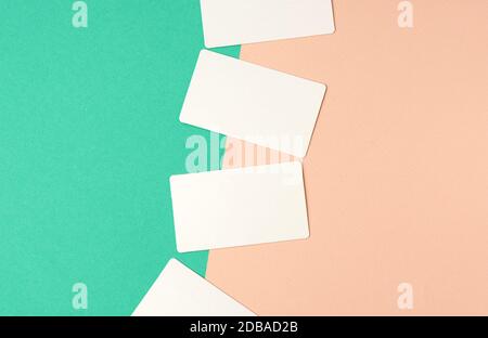 rectangular white blank business cards on a color background, backdrop for the designer Stock Photo