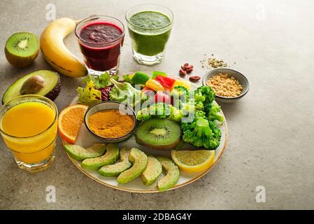 Healthy fresh fruit and vegetable smoothies with assorted ingredients served in glasses. Stock Photo