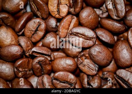 many brown roasted coffee beans, texture of coffee beans Stock Photo