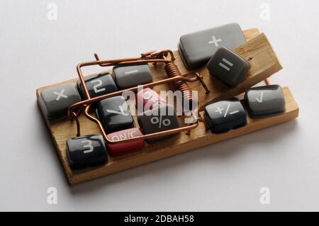 Keys of the electronic calculator on a mousetrap Stock Photo