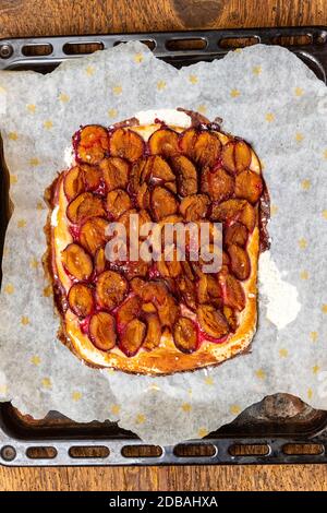 bavarian plum pie on dark wood Stock Photo