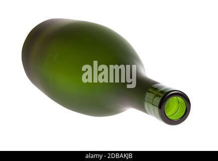 overturned empty green brandy bottle isolated on white background Stock Photo