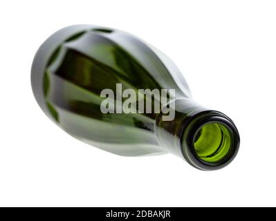 overturned empty faceted green wine bottle isolated on white background Stock Photo