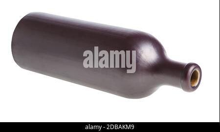lying black ceramic bottle isolated on white background Stock Photo