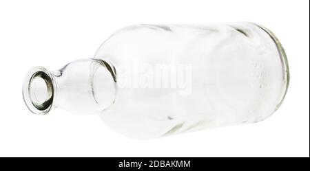 lying empty clear brandy bottle isolated on white background Stock Photo