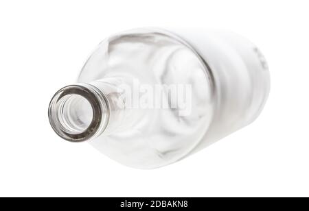 overturned empty clear bottle isolated on white background Stock Photo