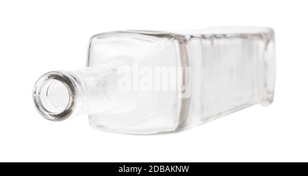 overturned empty clear wine bottle isolated on white background Stock Photo