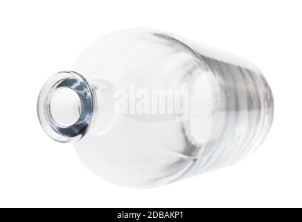 overturned empty clear liquor bottle isolated on white background Stock Photo