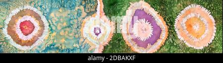 abstract pattern handmade in tie-dye and hot batik technique isolated on colored silk scarf Stock Photo