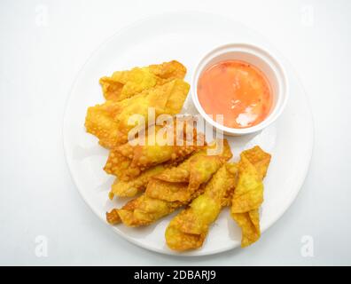 Deep Fried Won ton on white plate with dip source Stock Photo