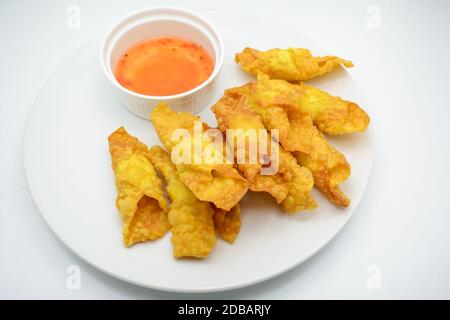 Deep Fried Won ton on white plate with dip source Stock Photo