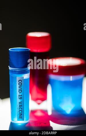 Conceptual image of a recipient containing a vaccine for coronavirus ...