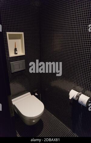 Bathroom / toilet with black mosaic tiles Stock Photo