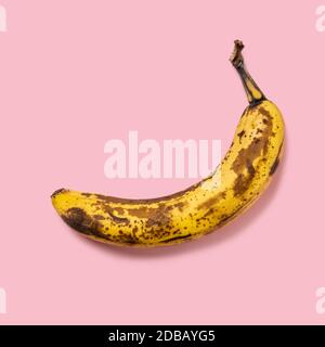 Overripe banana on pink background Stock Photo