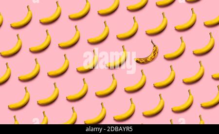 Rows of bananas on pink background Stock Photo