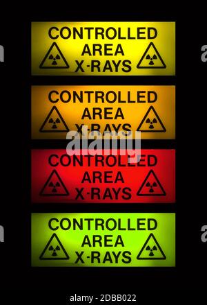 X-Rays sign in 4 different colours on black Stock Photo