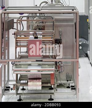 Automated Foil Packing Machine in Factory Production Stock Photo