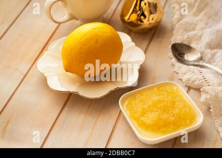 Lemon zest with zester behind zest. Grated and ground lemon, healhty lifestyle Stock Photo