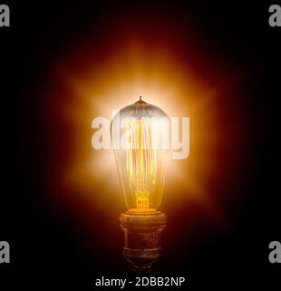 Edison light bulb on black background Stock Photo