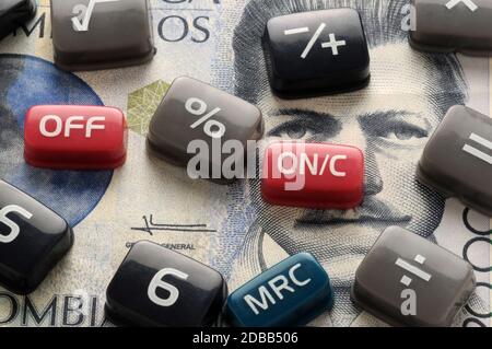 Keys of the electronic calculator on Colombian banknote Stock Photo