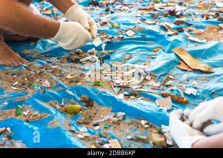 Beach Cleaning. Cleaning dirty beaches by the action of man. Sustainability of the planet and preservation of nature. Stock Photo