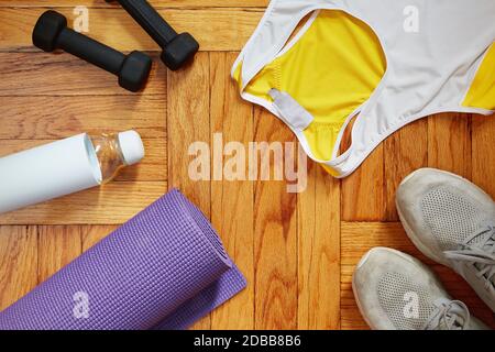 Sportswear and equipment on floor Stock Photo