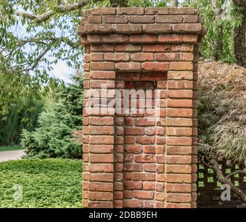 detail of a brick column in a summer landscape Stock Photo
