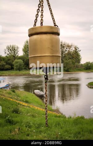 An old bell with which the ferryman was called on the Elbe. Stock Photo