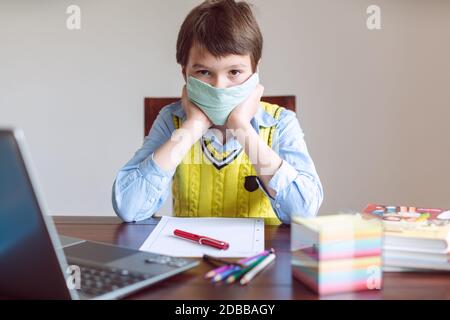 Stressed pupil in despair because schools are still closed due to Coronavirus Stock Photo