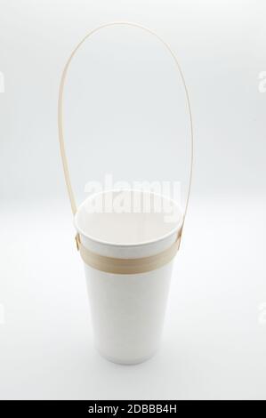 Eco friendly biodegradable rPaper drinking glass with Bamboo Handle - isolated on white background Stock Photo