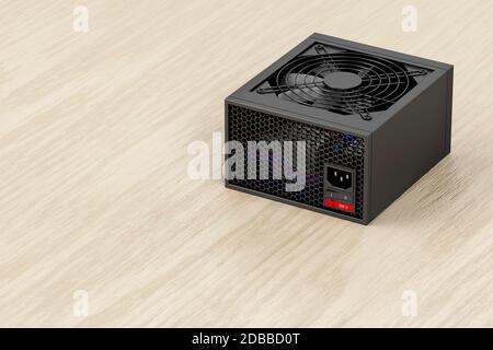 Black power supply unit for computer on wooden desk Stock Photo