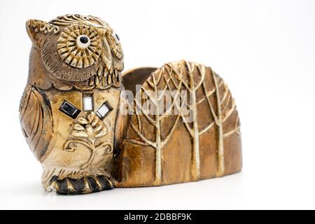 Sheet for notepad storage of notes, in a statue of an owl on a white background Stock Photo