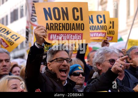Rome, Italy. 15th Feb, 2020. Protesters hold up placards and shout slogans during the demonstration of the Five Star Movement (M5S), in defense of the law that cuts the revenues of parliamentarians in Rome. Credit: Vincenzo Nuzzolese/SOPA Images/ZUMA Wire/Alamy Live News Stock Photo