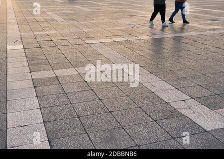 Pavement made smooth stone tiles on a square Stock Photo