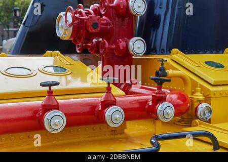 Old firefighting equipment on a ship, thick pipes and pumping machinery Stock Photo