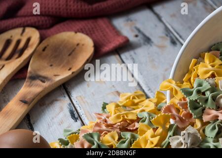 dry pasta on rustic wood and fresh eggs Stock Photo