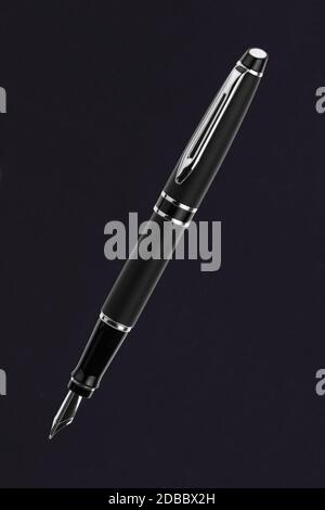 Black fountain pen on a black background Stock Photo