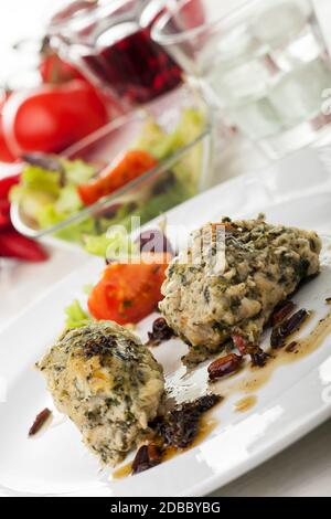 italian strangolapreti dumplings on a plate Stock Photo