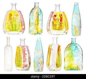 set of various hand painted glass bottles isolated on white background Stock Photo
